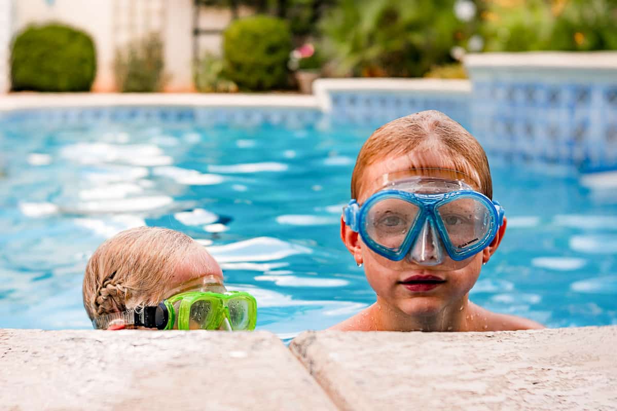 Safe Swimmer Pledge kids in pool with masks