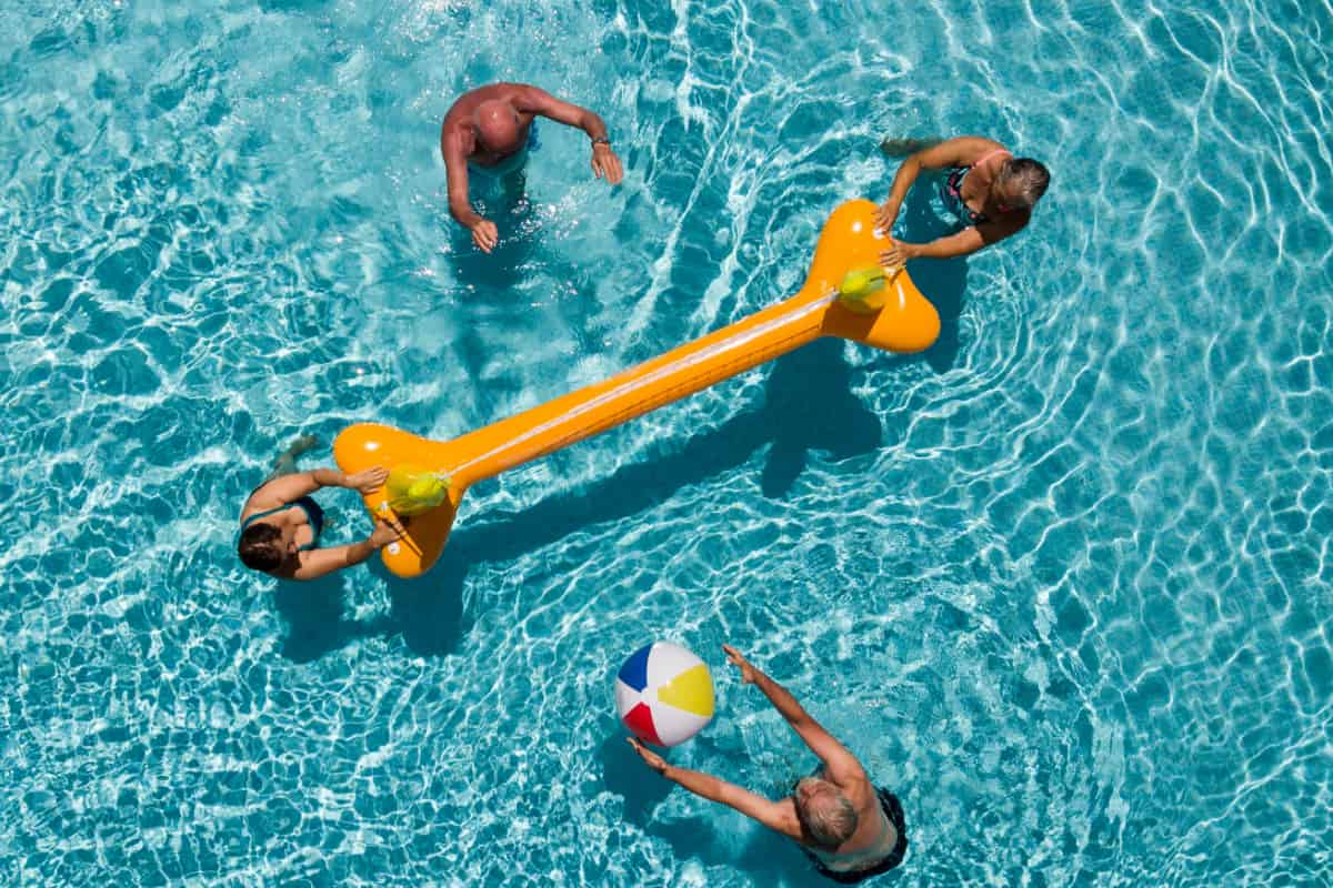 seniors playing with inflatable balloon seniors playing with inflatable balloon