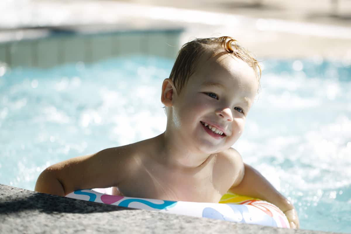 swimming lessons boy taking swimming lessons